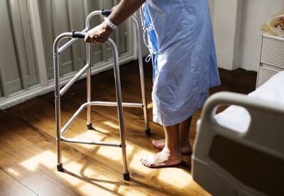 Man with a walker at a hospital