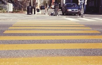 While crossing a road without zebra crossing, one must proceed only if